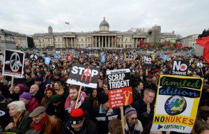 Protesters gather during an anti Trident rally, in Trafalgar Square, London, Saturday Feb. 27, 2016. Thousands have marched through London to oppose the renewal of Britain's Trident nuclear weapons system in what demonstrators describe as the biggest such rally in a generation. (Anthony Devlin/PA via AP) UNITED KINGDOM OUT NO SALES NO ARCHIVE